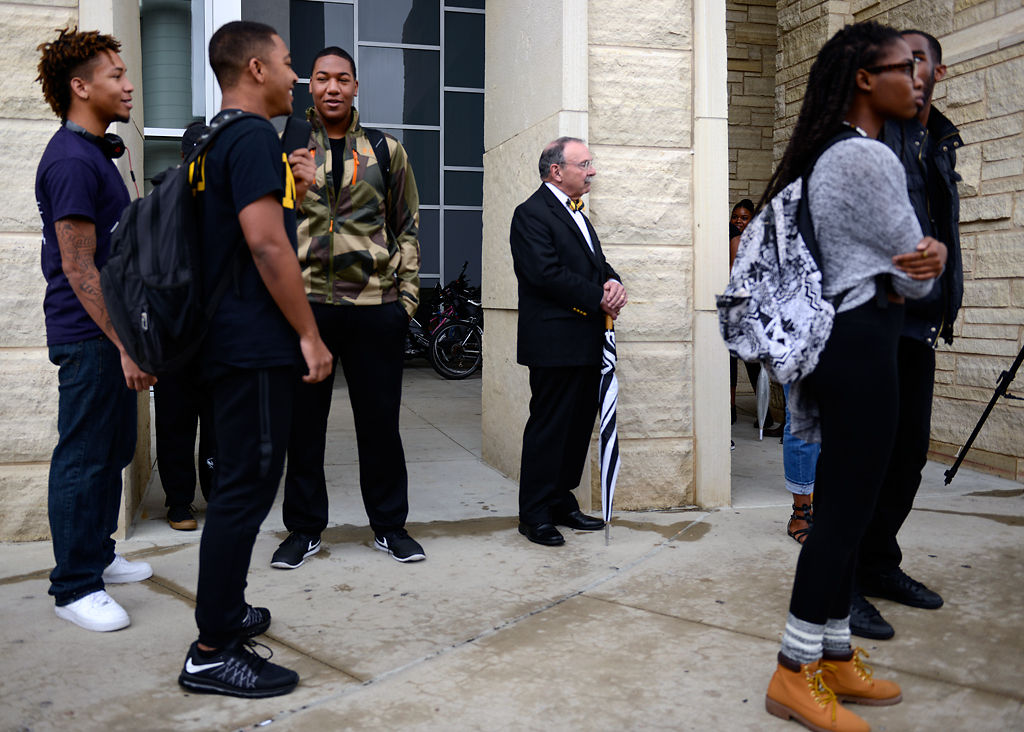 R. Bowen Loftin stands among students